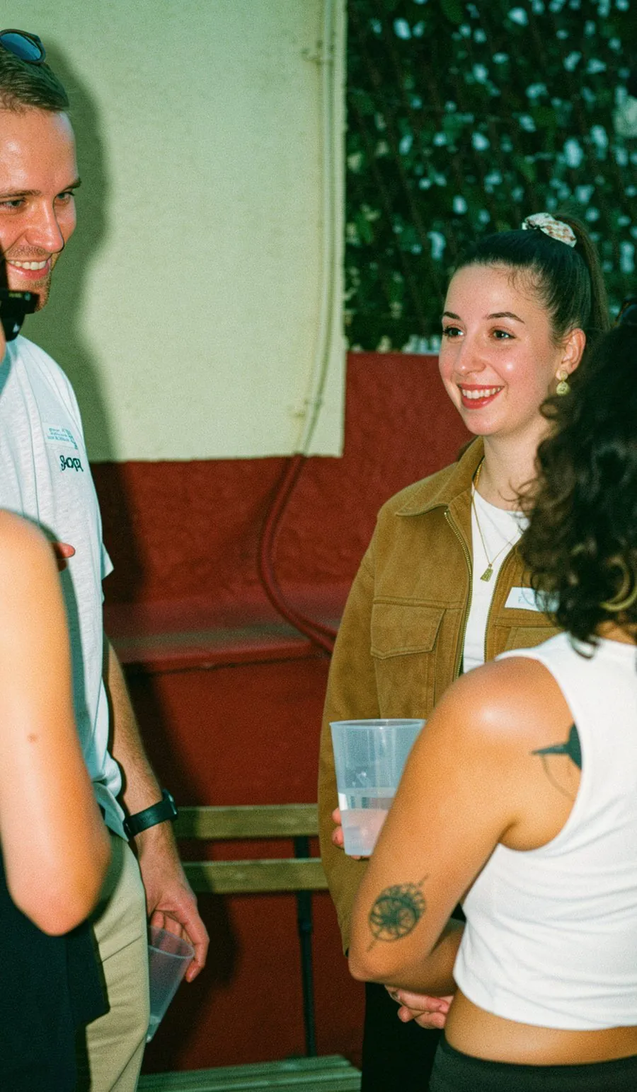 Two people having a meaningful conversation at a Happy to Gather event