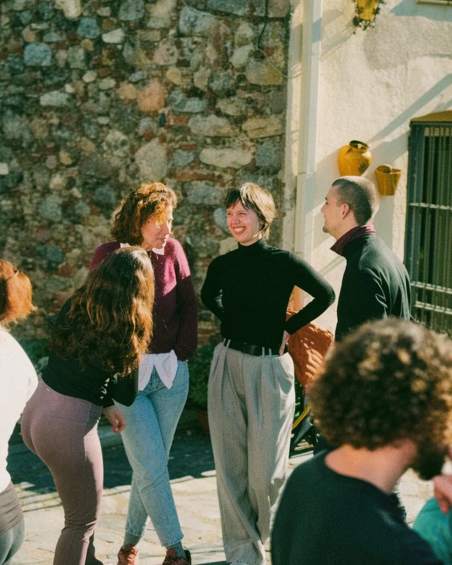 Group of friends laughing together during a Happy to Gather experience