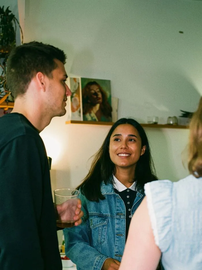 People having conversations during a Happy to Gather experience